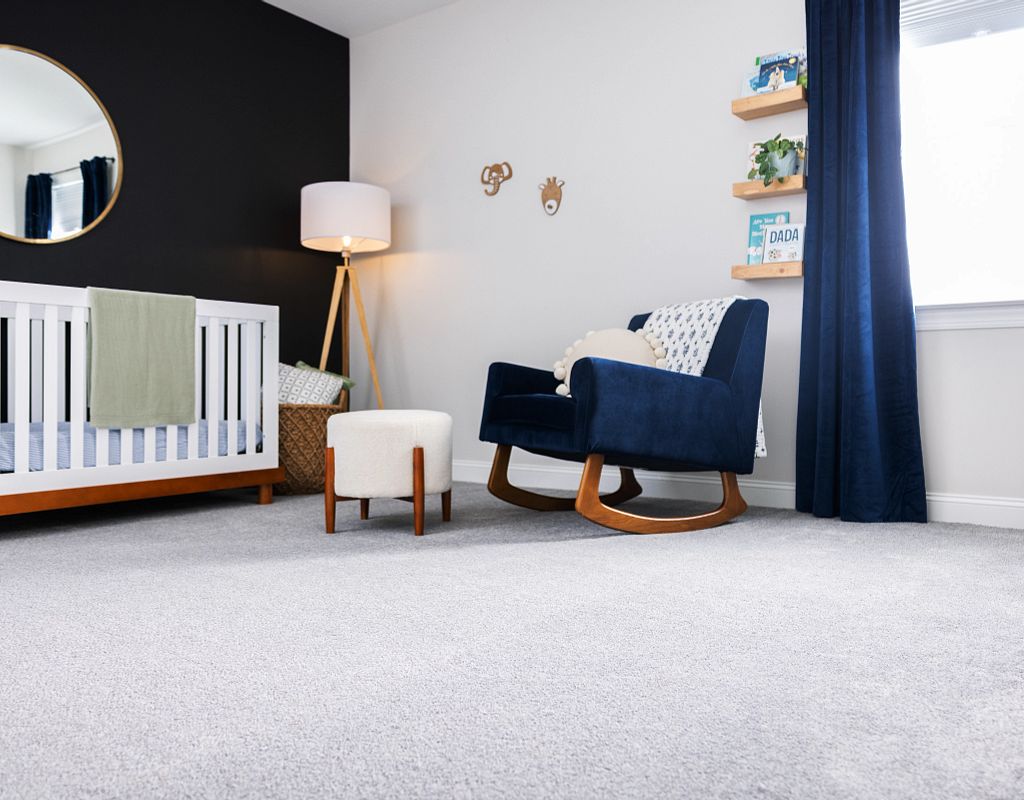 Blue chair on carpet floor | Magic Carpets