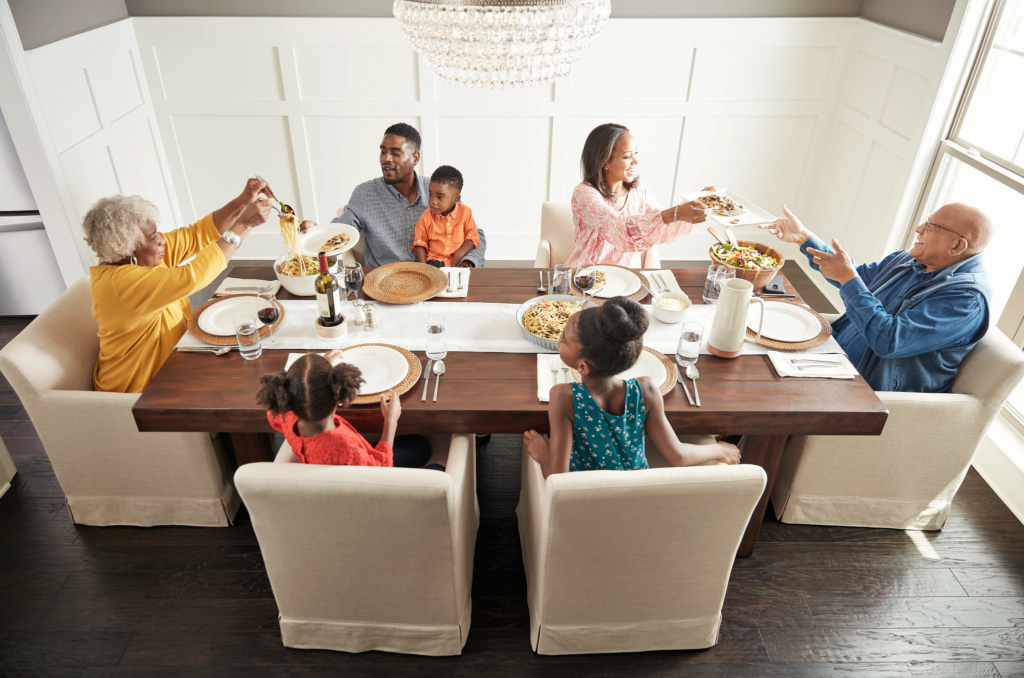 Family having breakfast at the dining table | Magic Carpets